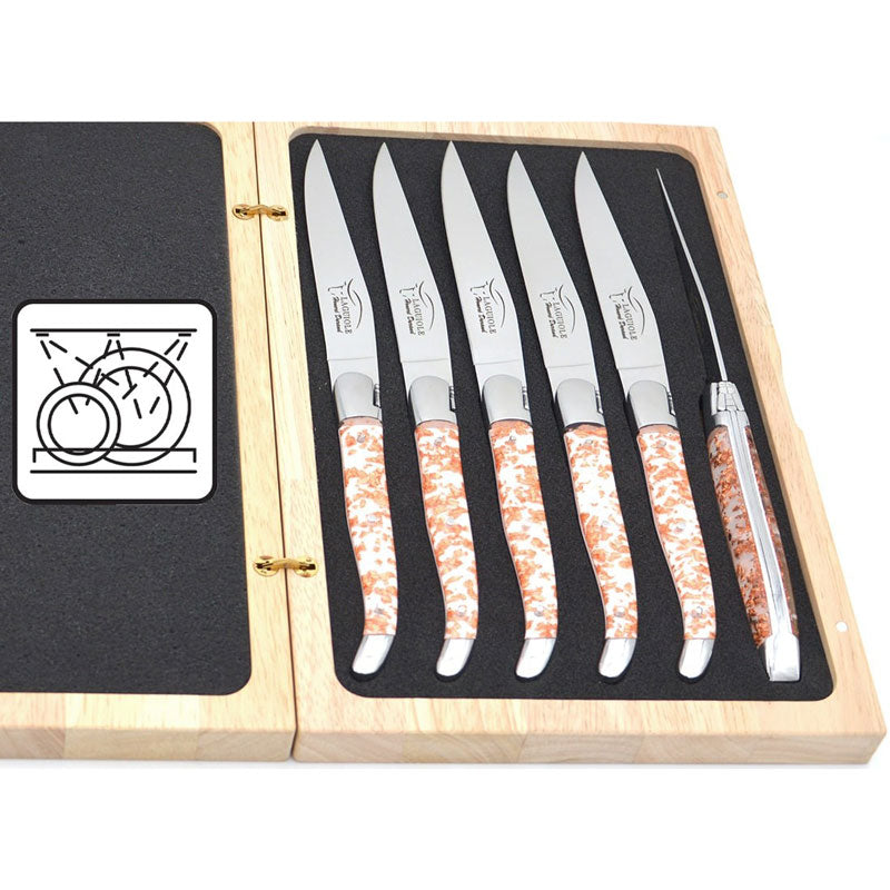 Laguiole steak knives. Slim white Corian handles with shiny